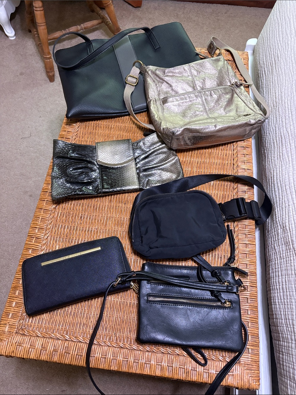 6 black/gold and silver bags. Including The Sak, Steve Madden and Express.
